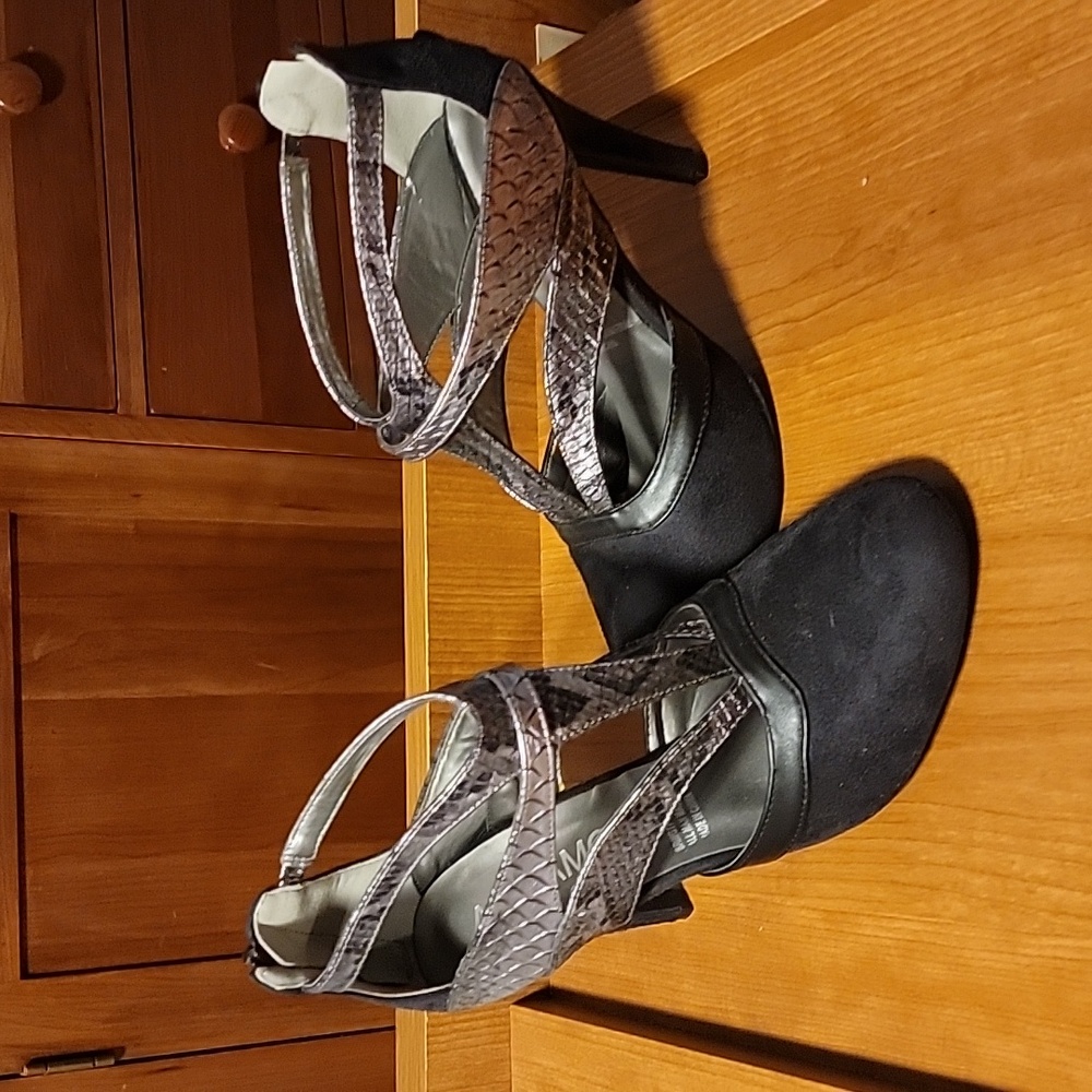 Black and metallic faux snakeskin trimmed high heeled shoes